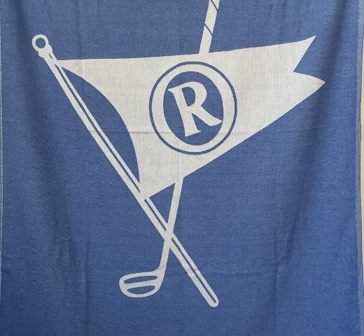Jacquard-woven Turkish towel with crossed golf club and pennant flag logo, detail crop