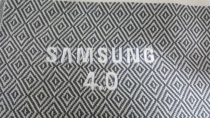 Embroidered logo on jacquard-base Turkish towel, produced as a corporate gift for a global technology brand
