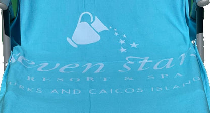 Jacquard-woven Turkish towel with watering can and star trail logo for a resort and spa, detail crop